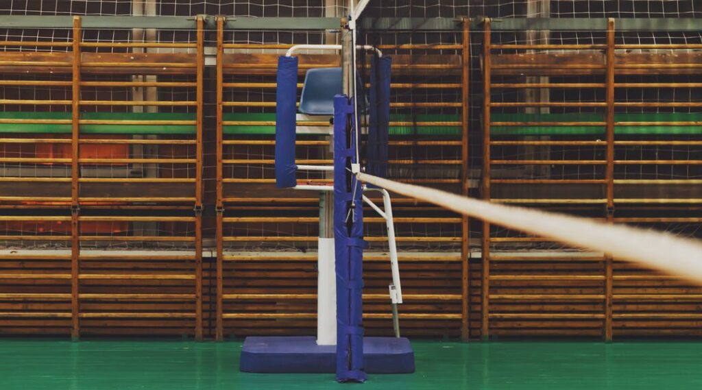 Sports Image of volleyball net in an old empty sports hall with referee tower